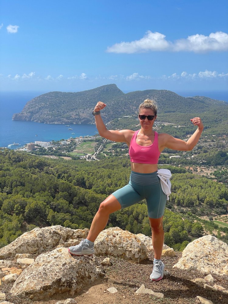 Reaching the viewpoint in Na Bruta with Camp de Mar in the background.